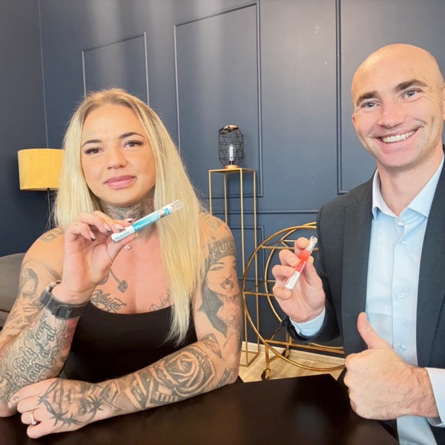 Lilija Sestoke and Nutrioz founder Simas Didzbalis holding Nutrioz vitamin sprays